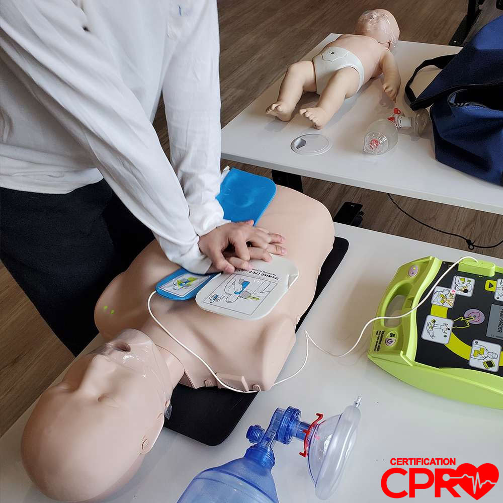 CPR training with mannequin and AED for certification in Las Vegas.
